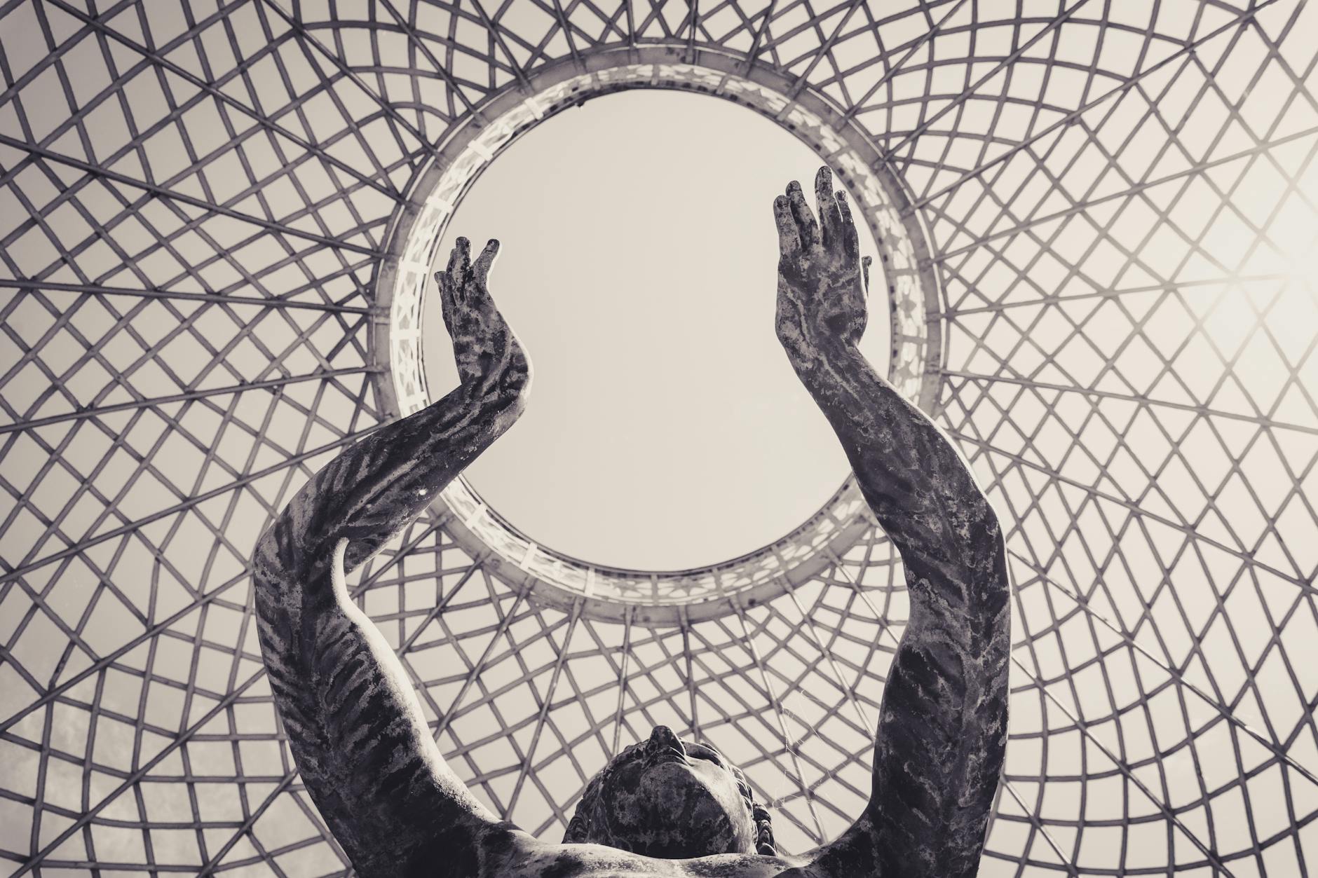 sculptural art beneath geometric canopy